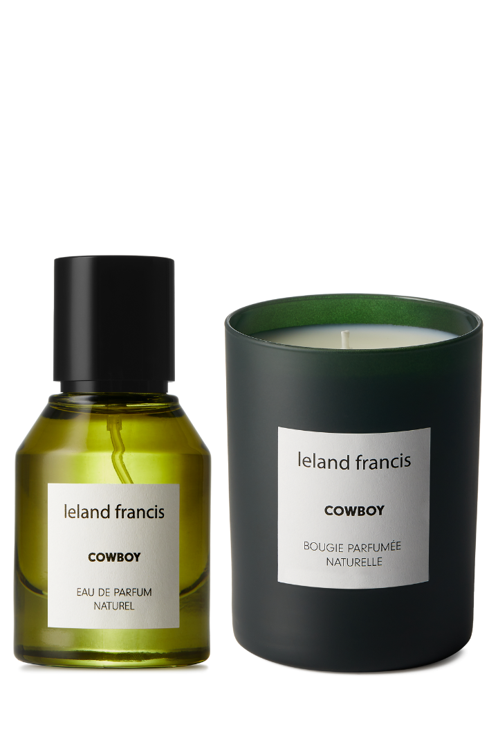 Leland Francis Cowboy perfume bottle and candle on a white background