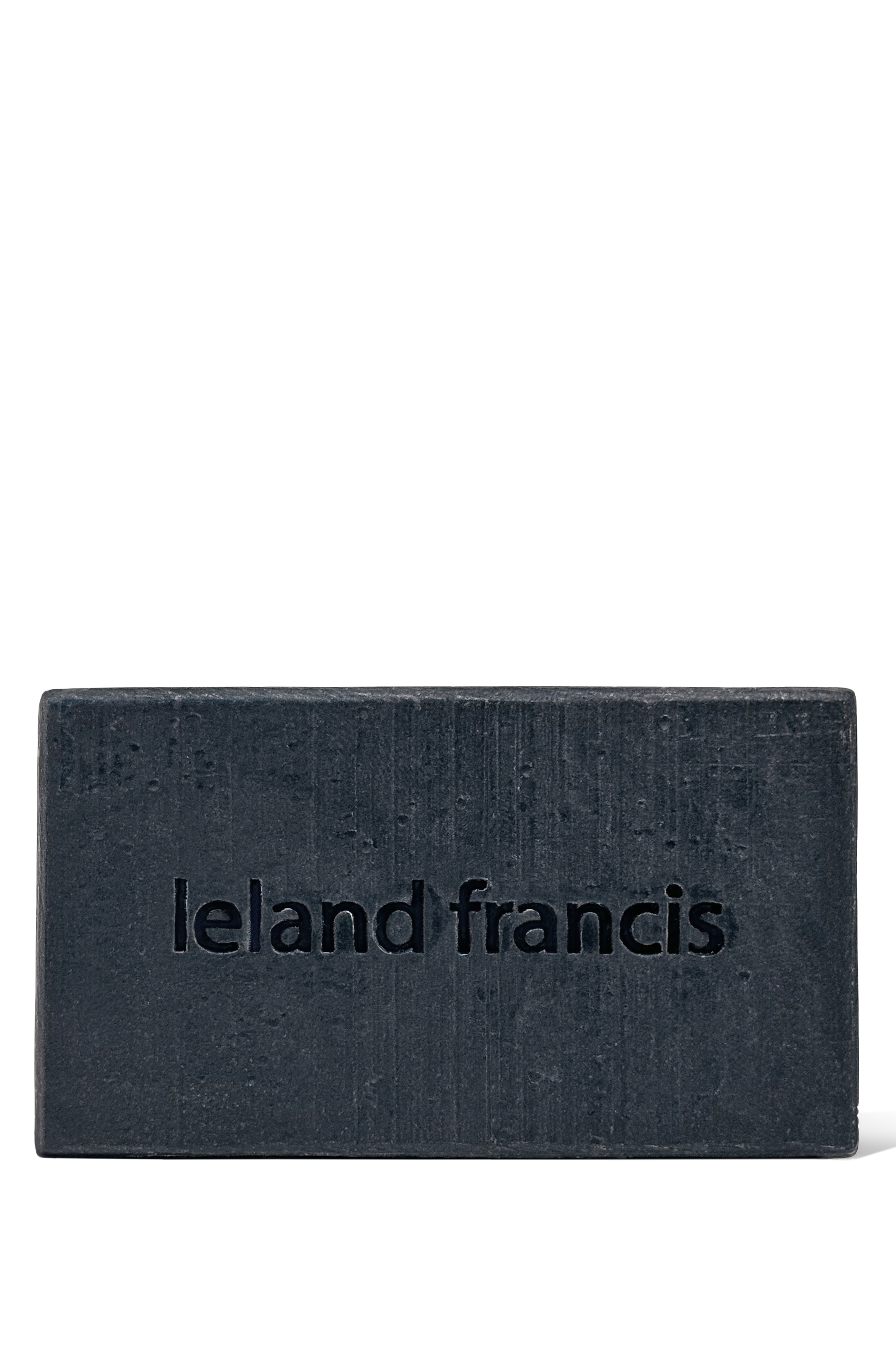 Bar of soap with 'leland francis' branding on a white background