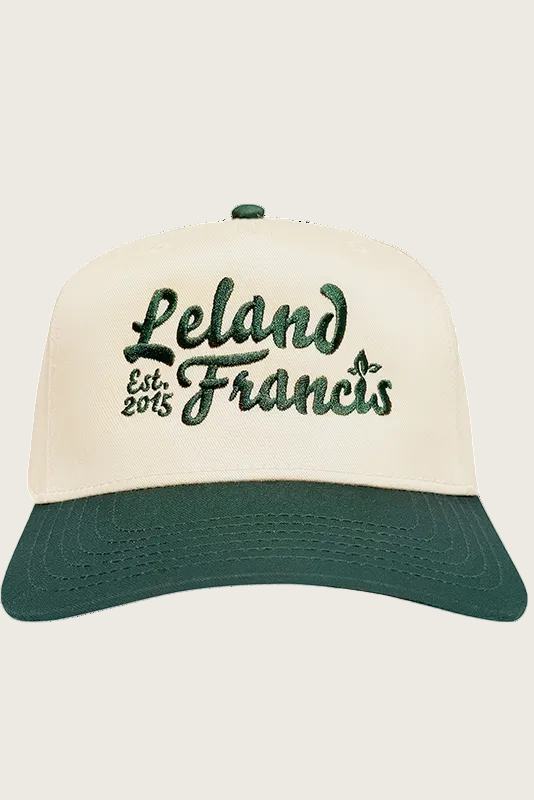 Cap with 'Leland Francis' text on a white background