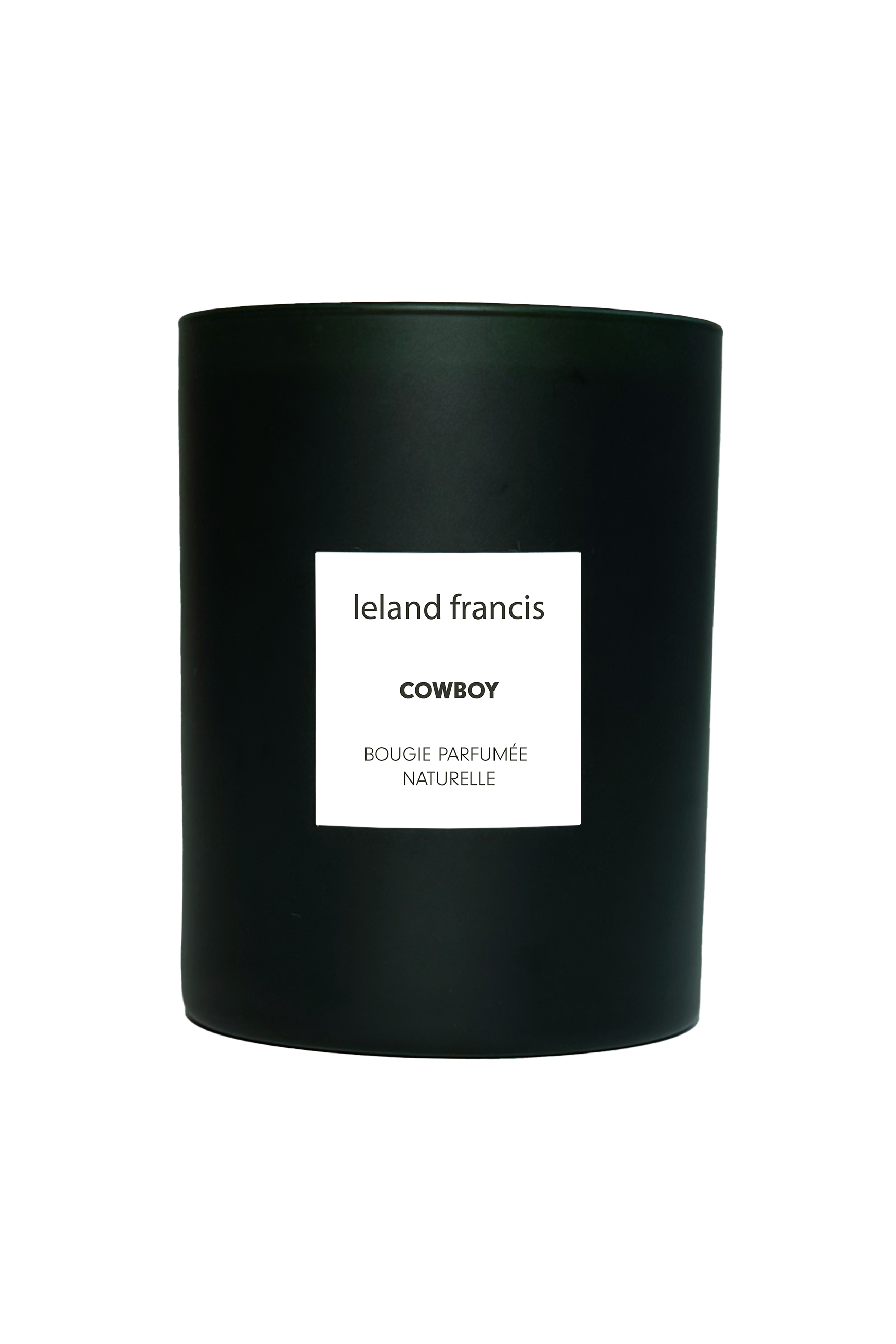 Black candle with a white label on a white background