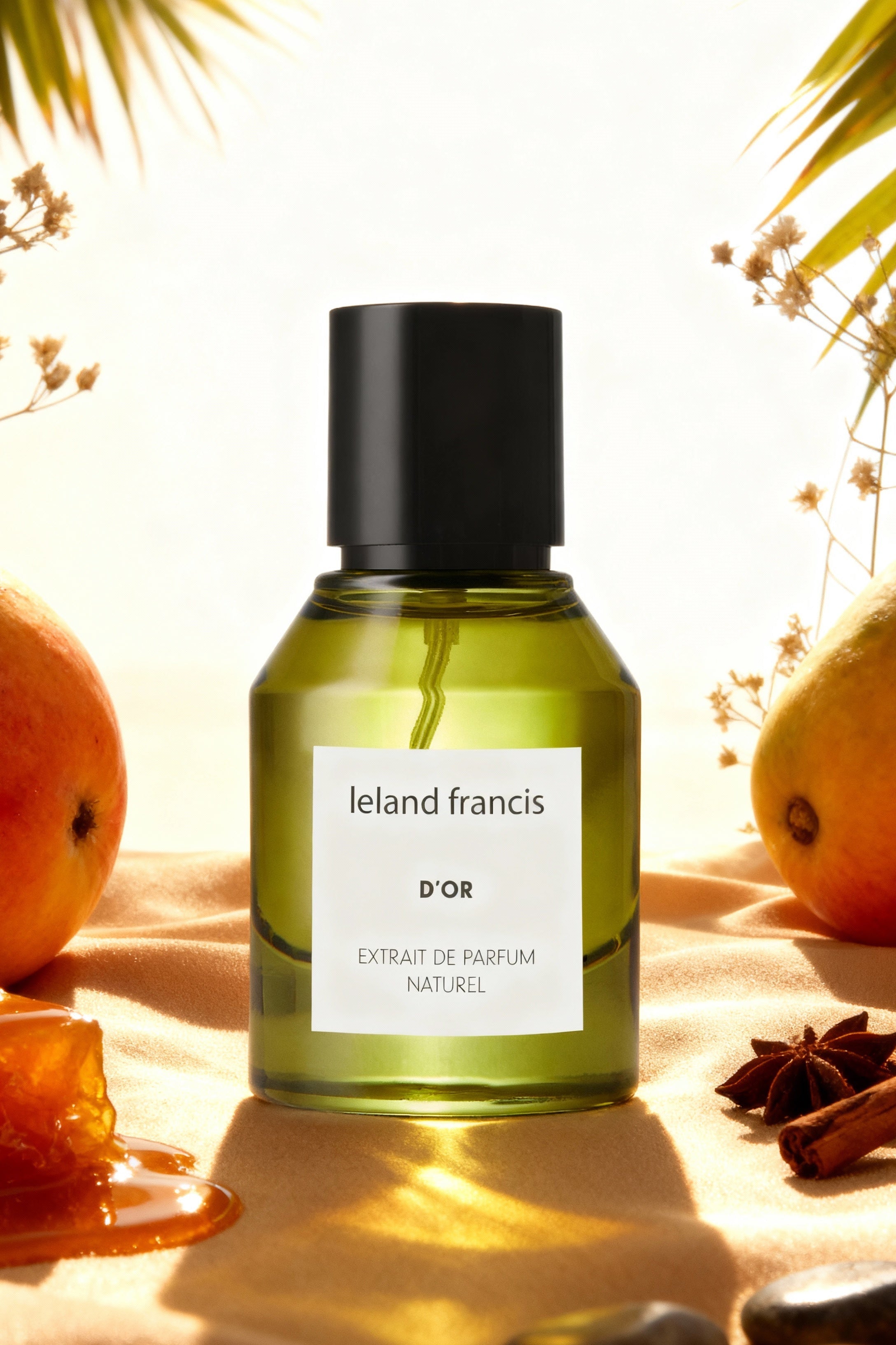 Green perfume bottle labeled 'Ieland Francis' with fruits and stones on a warm-toned background
