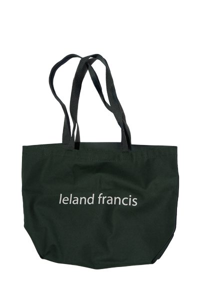 Black tote bag with 'Ieland Francis' branding on a white background