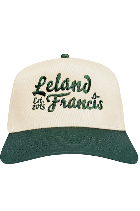 Cap with 'Leland Francis' text on a white background